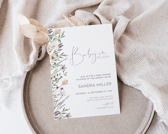 Editable lavender baby shower invitation with floral design and soft colors.