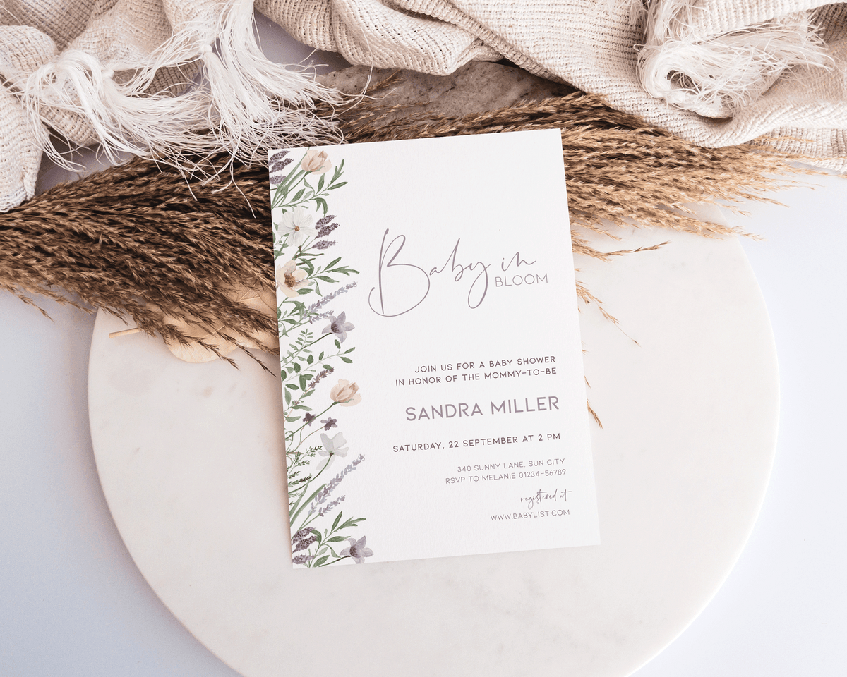 Printable baby shower invitation with purple watercolor florals.